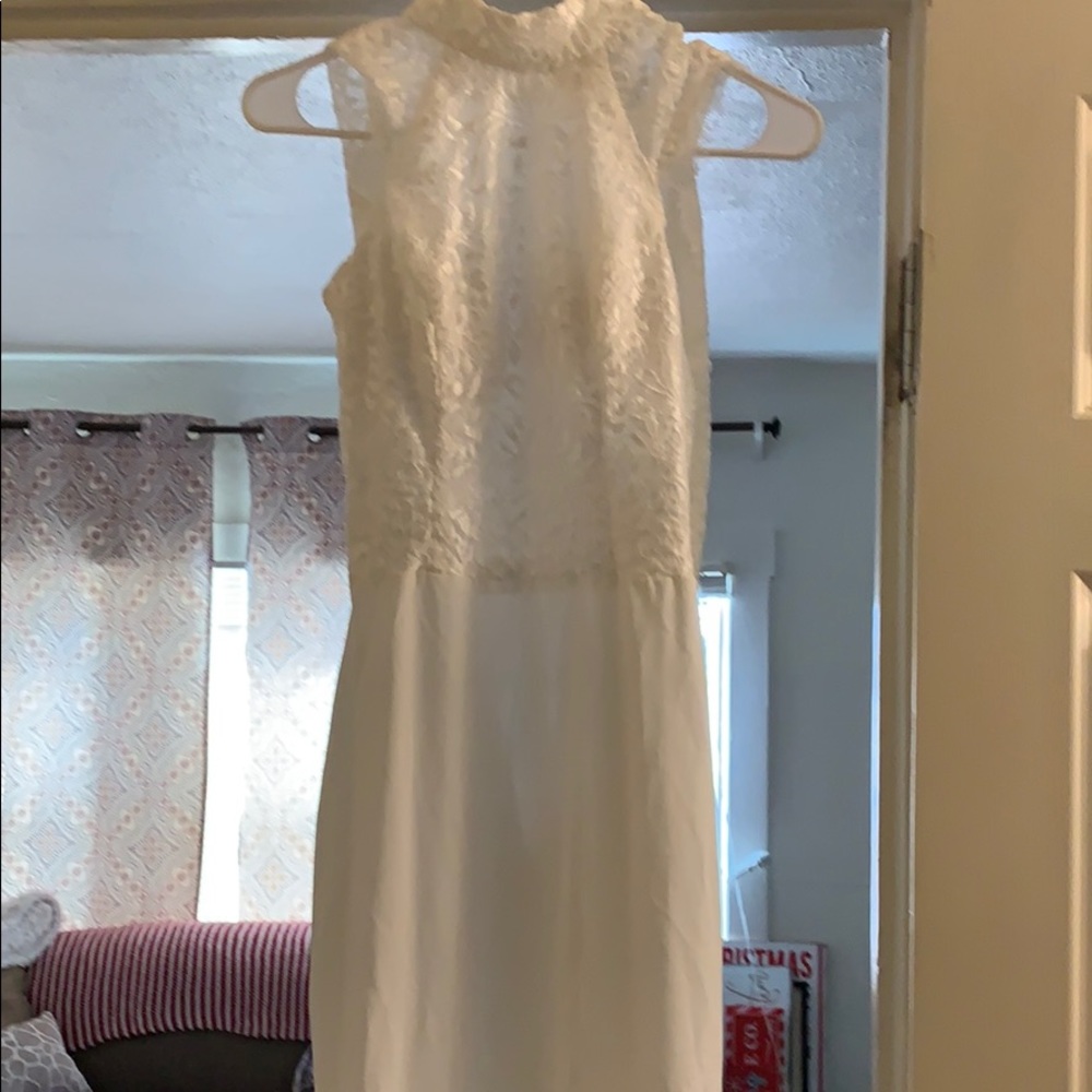 Never worn white lace dress hits above knee.